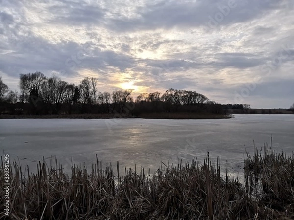 Obraz sunset over lake in winter