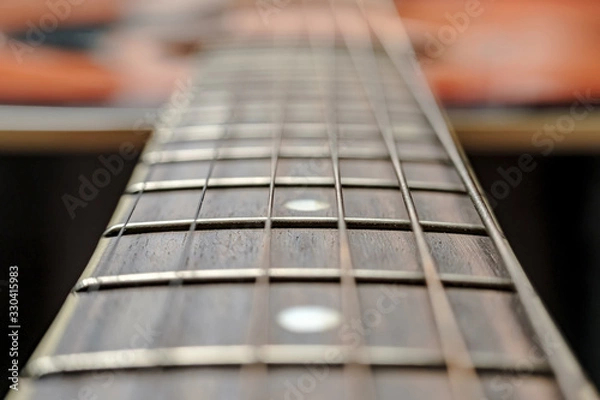 Obraz Neck with strings, close-up, on an old, classic acoustic guitar.