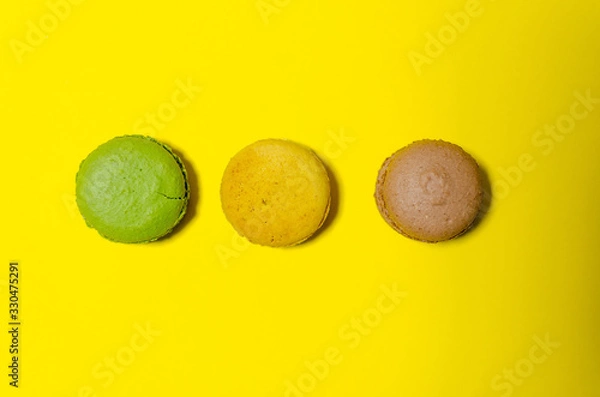 Fototapeta colored macaroons on a yellow background