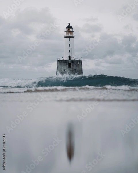 Fototapeta Lighthouse on the Beach