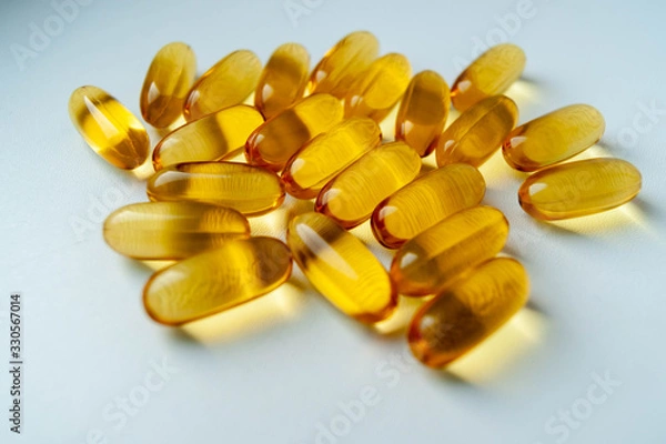 Obraz желтые таблетки на белом фоне