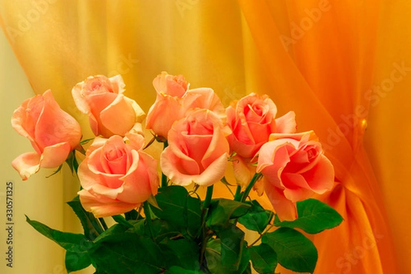 Fototapeta A bouquet of roses is on the background of curtains.
