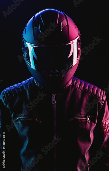 Obraz A guy in a motorcycle helmet and leather jacket against a background of neon lights and smoke
