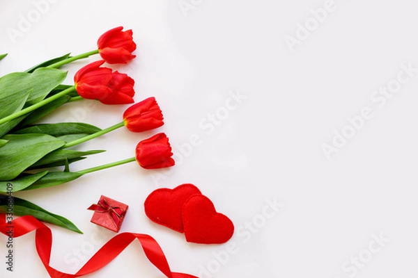 Fototapeta red tulips, ribbons, and hearts lay flat. concept of Valentine's Day. space for text