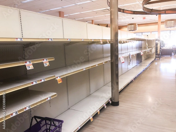 Fototapeta Boston,MA/ USA - March 16, 2020: Empty grocery store shelves because of the panic and overpurchase due to Novel Coronavirus COVID 19 fears