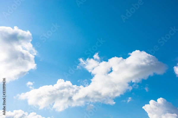 Fototapeta gorgeous cloudscape in springtime. weather background with dynamic cloud arrangement on a blue sky. sunny and windy day, good weather forecast concept