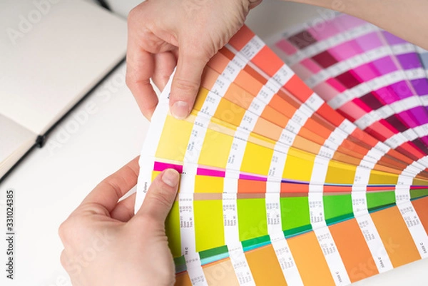 Fototapeta Graphic designer at work chooses color palette