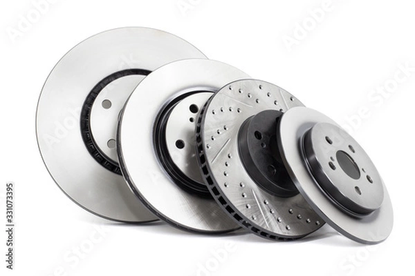 Fototapeta several different types of brake discs on a white background
