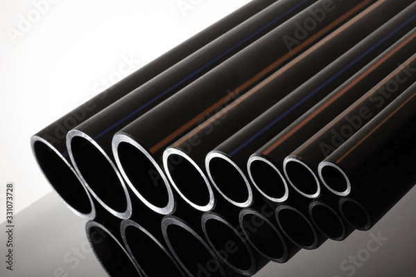 Obraz Polyethylene tubes of different diameters for water and gas. Pipeline transportation equipment. Production of polypropylene pipes.