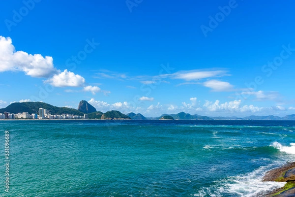 Fototapeta Sunny day at Copacabana beach with the hills of Rio de Janeiro in the background
