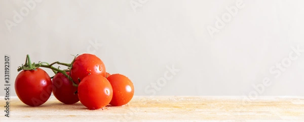 Obraz tomatoes on wooden board