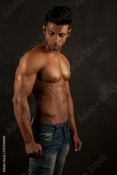 Obraz Tanned body builder posing athletic body