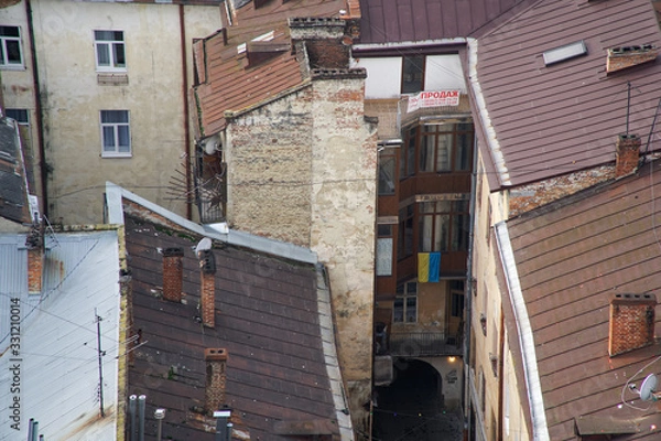 Fototapeta Lviv panorama. Aerial view on the old roof in centre of Lviv in Western Ukraine, with on the left the Uspensky church and on the right the Dominican church and the Town Hall