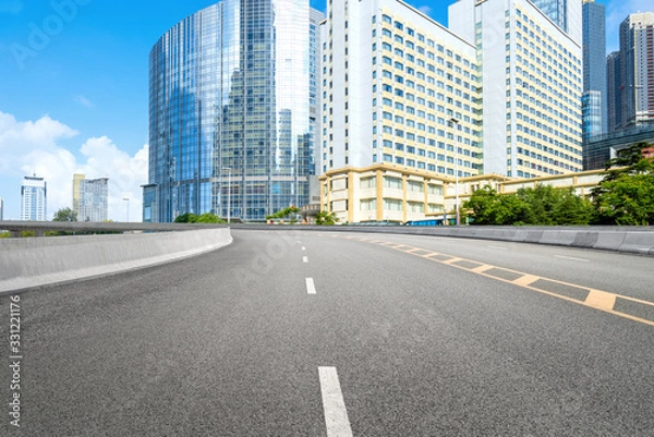 Fototapeta empty highway with cityscape and skyline of qingdao,China.