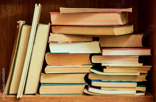 Fototapeta Many books on the bookshelf