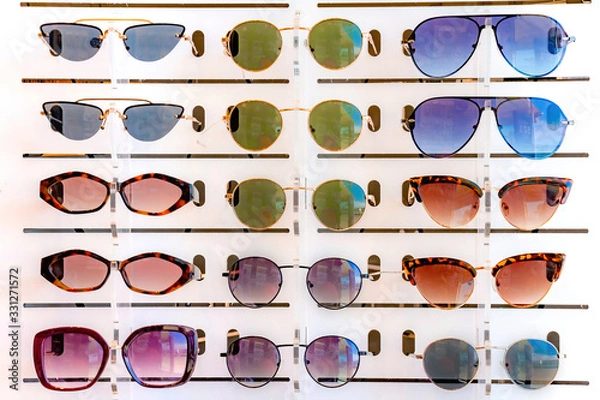 Obraz Stand with many sunglasses in a store of optics