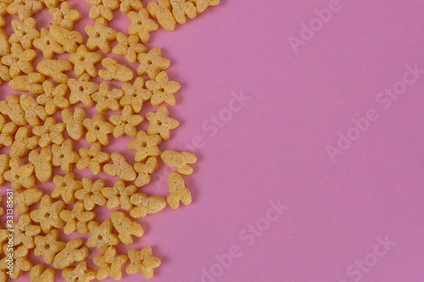 Obraz Breakfast cereal on a pink background. Top view, copy space.