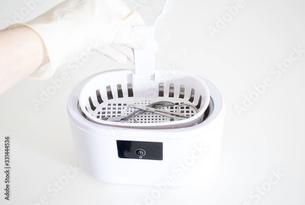 Fototapeta Cleaning systems for medical instruments. Ultrasonic cleaner on white background