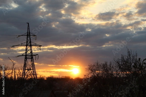 Fototapeta sunset over field