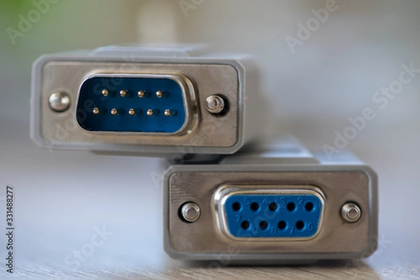 Fototapeta Close-up of a RS-232 serial port. Female to male extension cord on a wooden table.