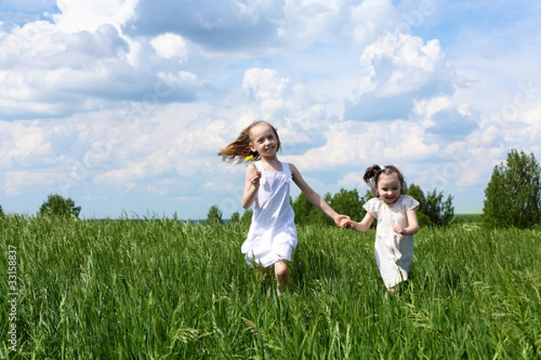 Obraz two little sisters outdoors