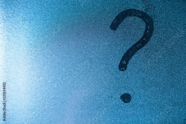 Fototapeta Question mark written by a finger on a misted glass. copy space
