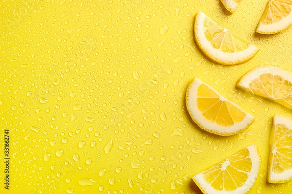 Obraz Lemon slices on yellow background