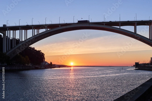 Fototapeta Arched bridge high above the strait