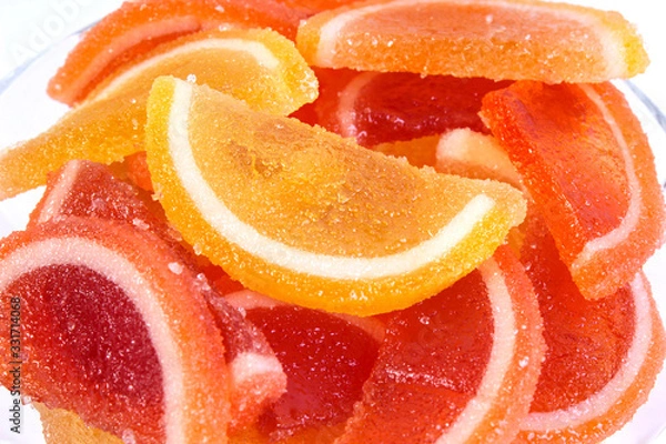 Fototapeta citrus marmalade in a candy bowl on a white background