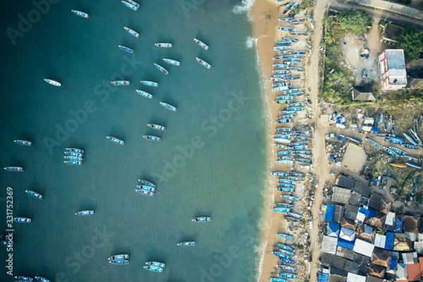 Obraz Aerial top view of fishing harbour with many traditional fisherman boats in Kerala, India.
