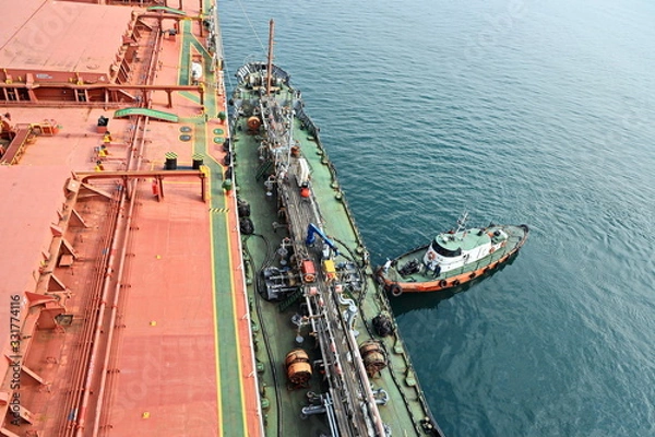 Obraz Bunkering of a ship on the open roadstead of the port of Nakhodka, Russia.