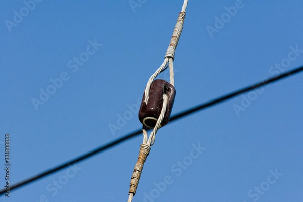 Obraz Insulator for tie down on utility pole