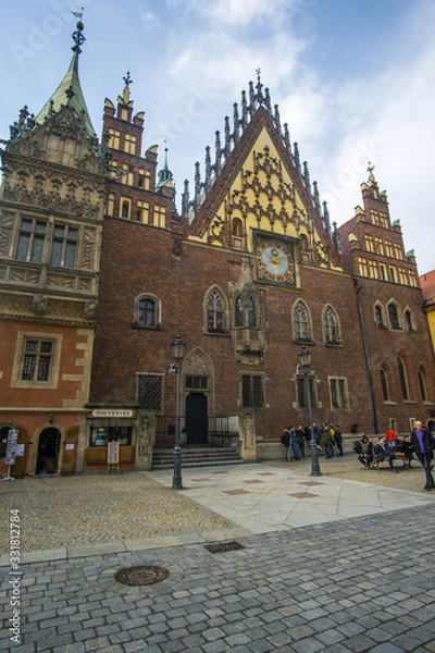 Fototapeta The Market Square in the city center of Wrocław city in Poland. in the picture you see the old colorful buildings and the Old town hall building 