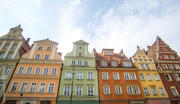 Fototapeta The Market Square in the city center of Wrocław city in Poland. in the picture you see the old colorful buildings and the Old town hall building