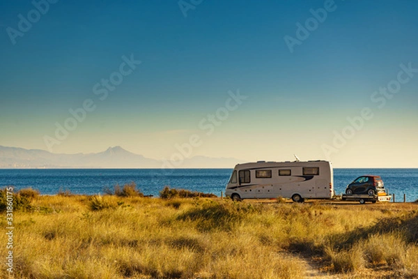 Fototapeta Camper on beach with little car on platform