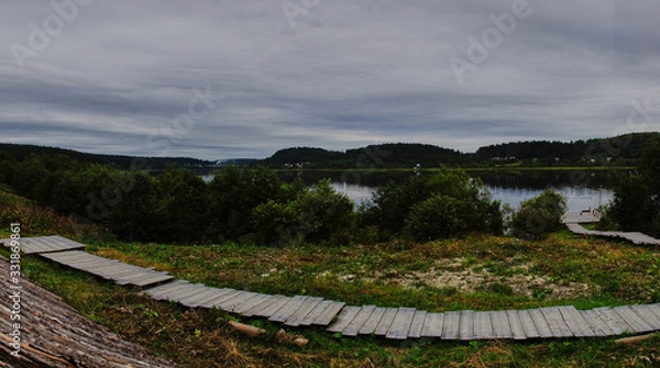 Obraz Panorama of the water landscape of Karelian nature.Panoramic view of the water surface: coniferous forest, smooth surface of the lake, open horizon. Russia, Karelia, Sortavala