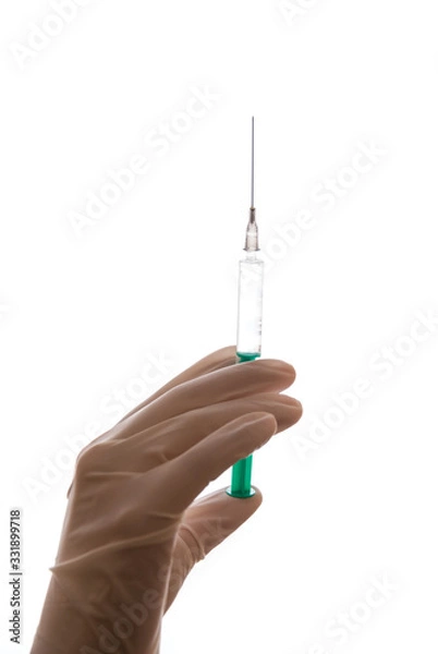 Obraz Hand with sterile glove holding syringe with vaccine against coronavirus covid-19 SARS-CoV-2