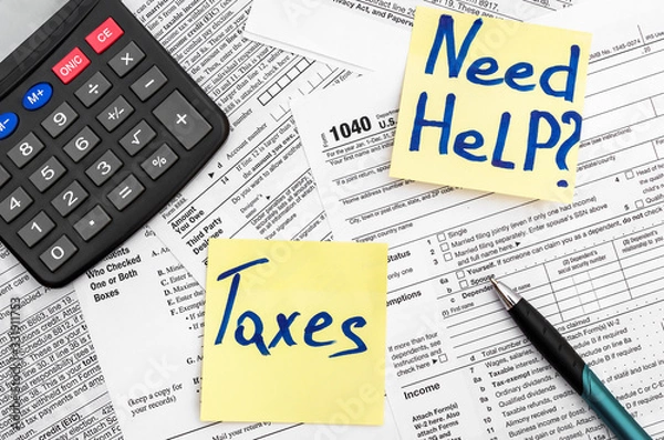 Fototapeta Need help and taxes text on stickers with tax forms. Assistance with filing tax form and calculation.