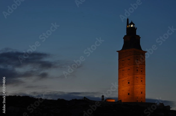 Obraz lighthouse at sunset iluminated by lights