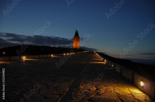 Obraz lighthouse at sunset iluminated by lights
