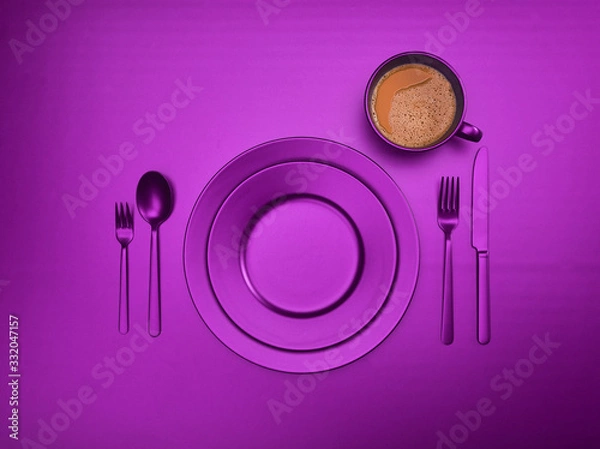 Fototapeta Cup of coffee with blue plates, fork, knife and spoon, top view. Ceramic dishes with a set of cutlery. Empty blue dishes for breakfast or dinner in a restaurant. Copyspace for your individual text.