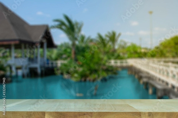 Fototapeta display products on the table, background, beside the pool and water pavilion