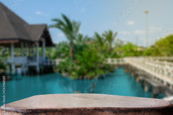 Fototapeta display products on the table, background, beside the pool and water pavilion