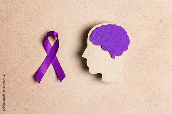 Obraz Purple awareness ribbon and brain symbol on a brown background. Epilepsy disease or Alzheimer disease awareness world day.