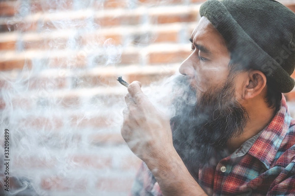 Obraz closed up mustache man smoke marijuanna joint