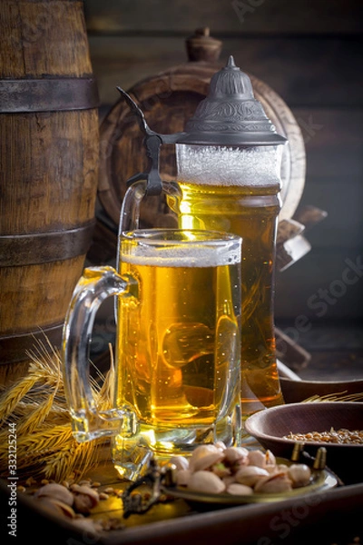 Fototapeta Light beer in a glass on a table in composition with accessories on an old background