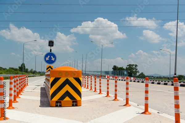 Fototapeta Crash Cushion or  Impact Attenuator installed in highway intersections and accident-prone areas.