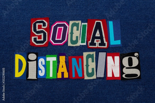 Fototapeta SOCIAL DISTANCING Coronavirus COVID-19 symptom, text word collage, worldwide pandemic flu virus containment, colorful letters on blue denim, horizontal aspect