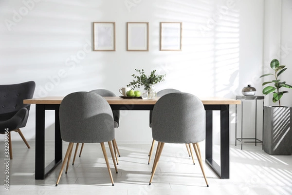 Fototapeta Stylish room interior with table and chairs. Idea for design