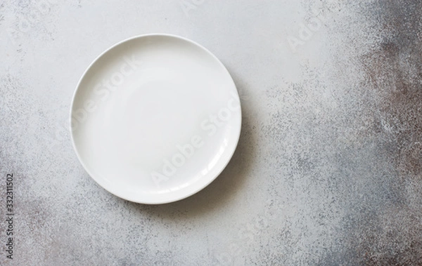 Obraz White empty ceramic plate on a gray stone background